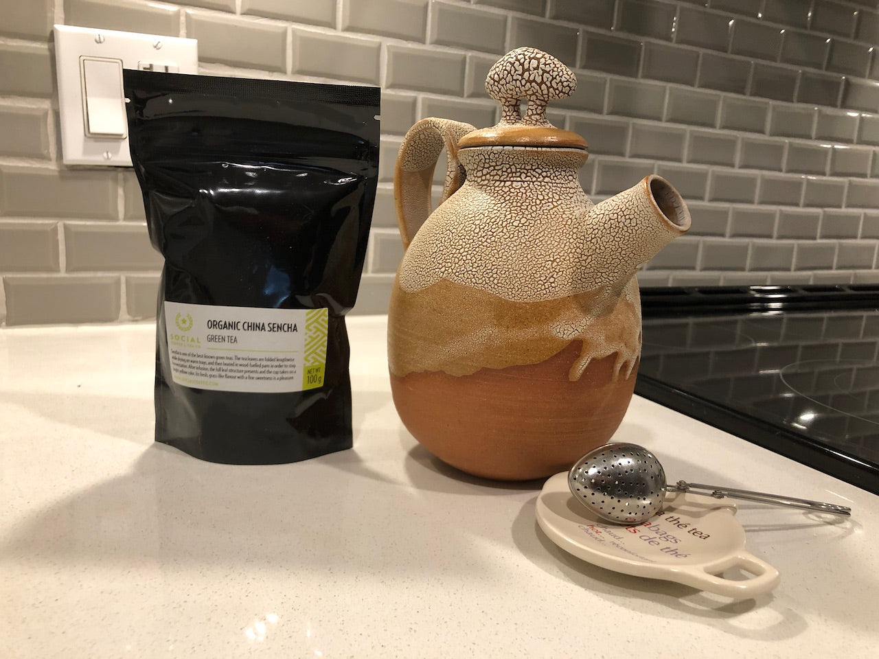 Ceramic Tea Pot & 100g Organic China Sencha Green Tea $10.00 will go to your selected charity.