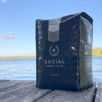 Social Coffee Company's Farmer's Collective coffee placed on a dock.