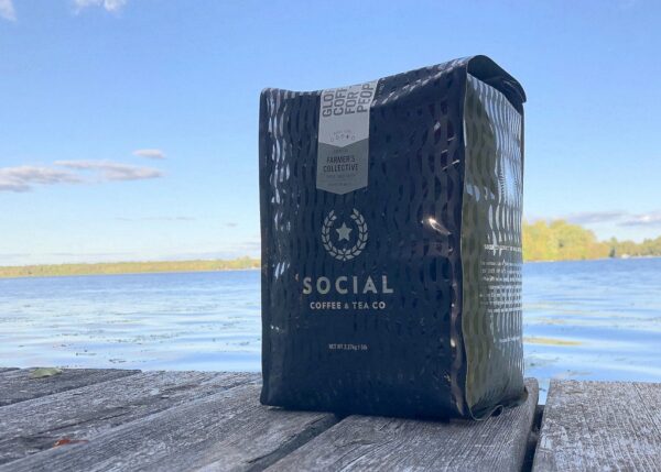 Social Coffee Company's Farmer's Collective coffee placed on a dock.