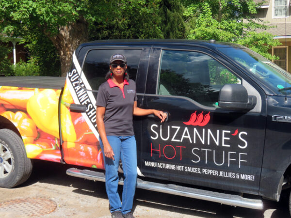 Truck with side emblem that says Suzanne's Hot Stuff